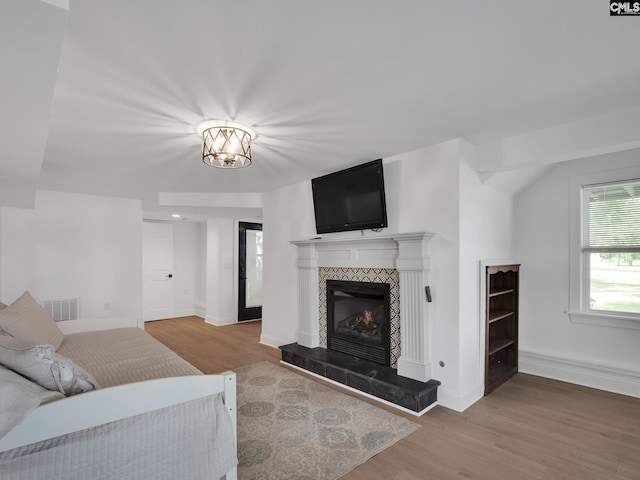 1513 Molly Creek Cir, Ridgeway, SC 29130 - living room with wood finished floors, a tile fireplace, and baseboards