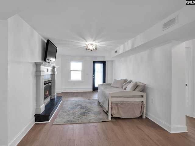 1513 Molly Creek Cir, Ridgeway, SC 29130 - bedroom with wood finished floors, baseboards, and a warm lit fireplace