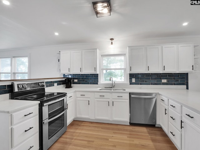 1513 Molly Creek Cir, Ridgeway, SC 29130 - kitchen featuring stainless steel appliances, a sink, open shelves, a peninsula, and ornamental molding