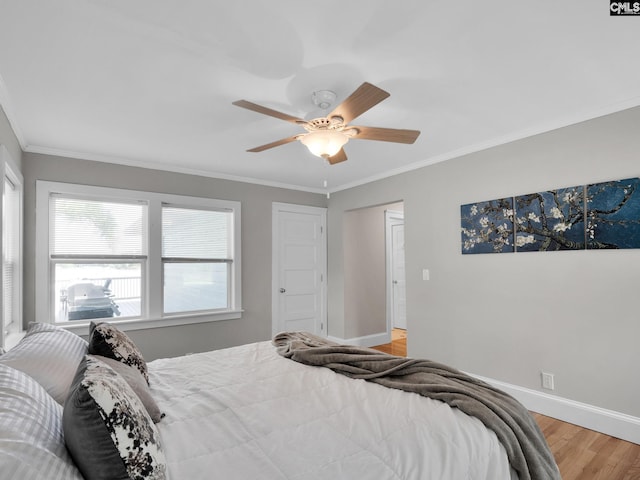 1513 Molly Creek Cir, Ridgeway, SC 29130 - bedroom featuring multiple windows, light wood-style floors, crown molding, baseboards, and ceiling fan