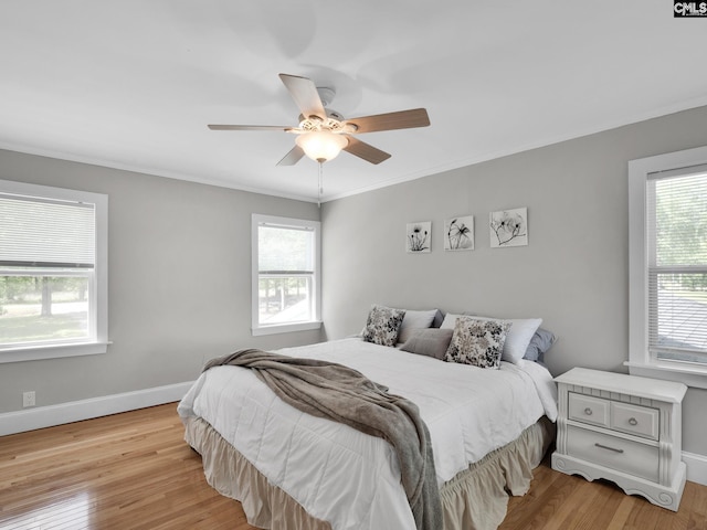1513 Molly Creek Cir, Ridgeway, SC 29130 - bedroom with light wood-style flooring, baseboards, crown molding, and ceiling fan