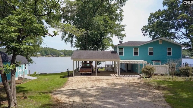 1513 Molly Creek Cir, Ridgeway, SC 29130 - view of front of home featuring driveway, a front yard, and a water view