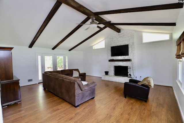 805 Mcrae Rd, Camden, SC 29020 - living area with a ceiling fan, beam ceiling, a fireplace, french doors, and wood finished floors