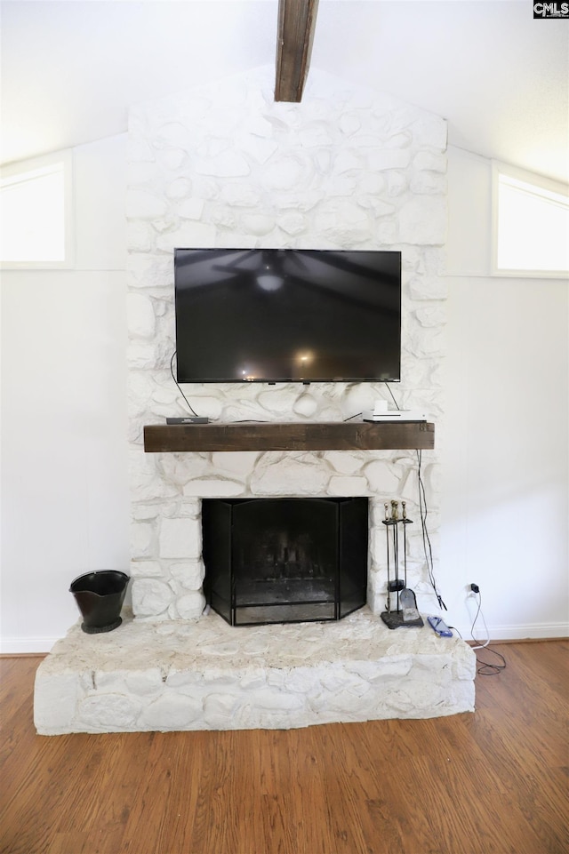 805 Mcrae Rd, Camden, SC 29020 - detailed view of a stone fireplace, wood finished floors, baseboards, and beam ceiling