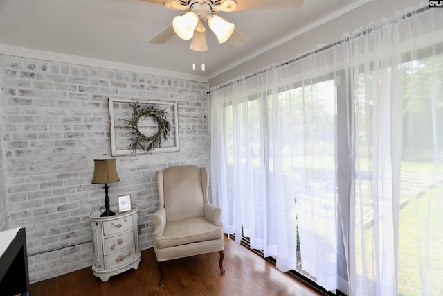 805 Mcrae Rd, Camden, SC 29020 - sitting room with a ceiling fan, wood finished floors, ornamental molding, and brick wall
