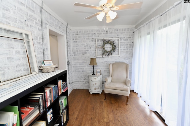805 Mcrae Rd, Camden, SC 29020 - sitting room featuring a ceiling fan, wood finished floors, crown molding, and brick wall