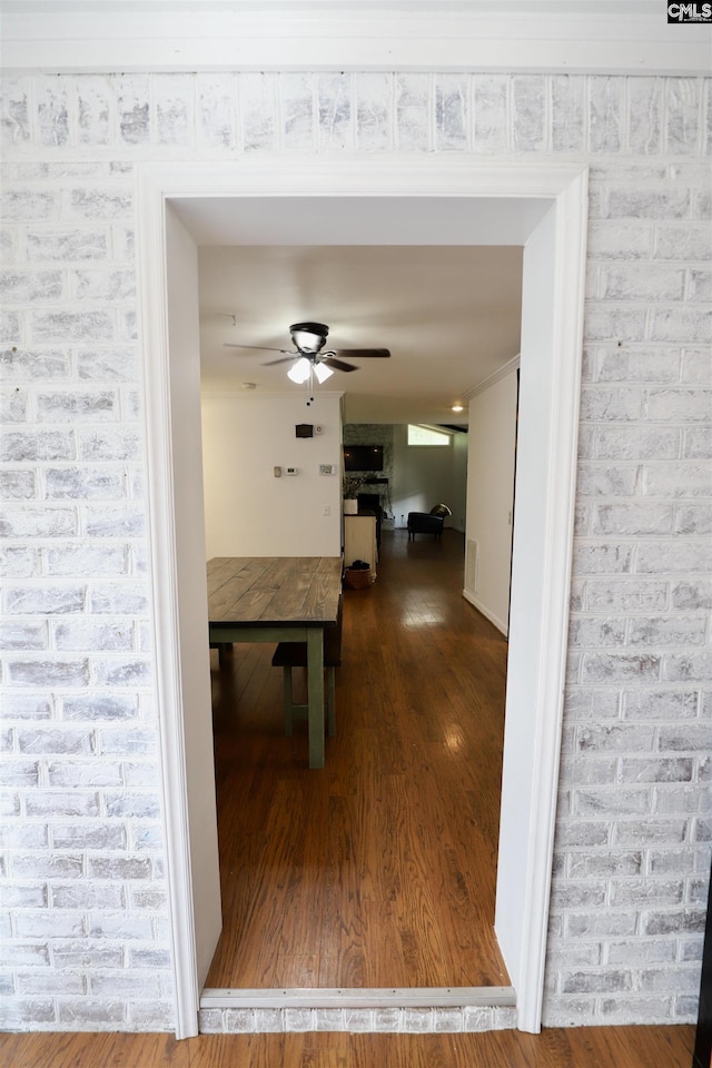 805 Mcrae Rd, Camden, SC 29020 - hallway with wood finished floors and brick wall