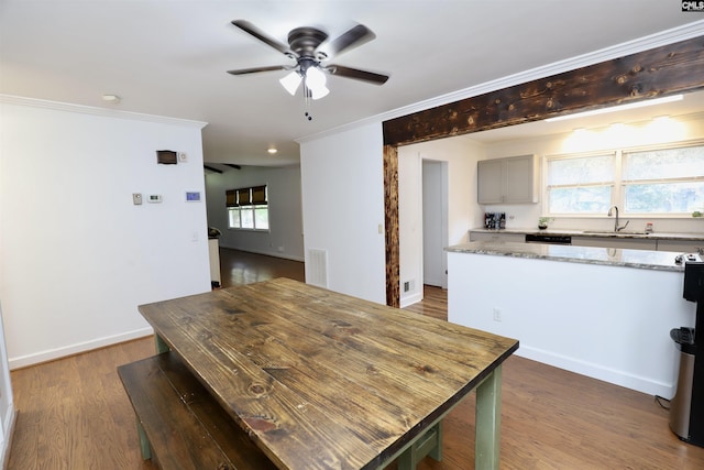 805 Mcrae Rd, Camden, SC 29020 - dining area featuring a ceiling fan, ornamental molding, wood finished floors, and baseboards