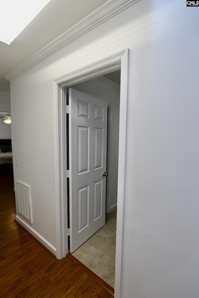 805 Mcrae Rd, Camden, SC 29020 - hallway with ornamental molding, wood finished floors, and baseboards