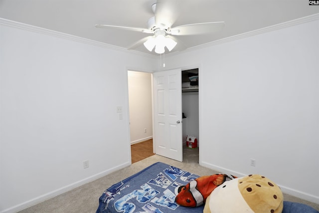 805 Mcrae Rd, Camden, SC 29020 - carpeted bedroom featuring crown molding, baseboards, a ceiling fan, and a closet