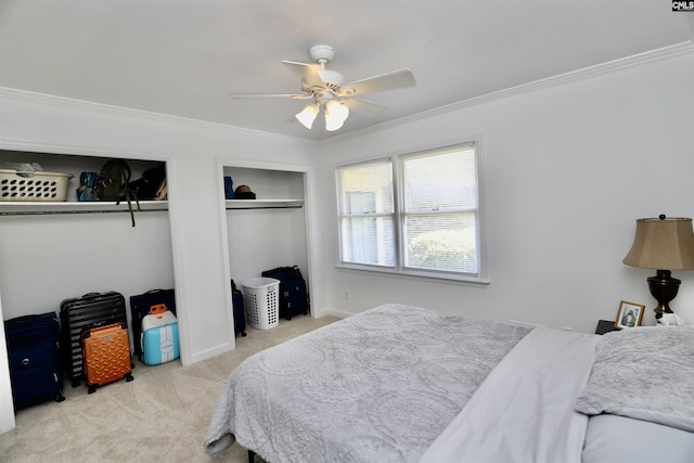 805 Mcrae Rd, Camden, SC 29020 - carpeted bedroom featuring two closets, ornamental molding, baseboards, and ceiling fan