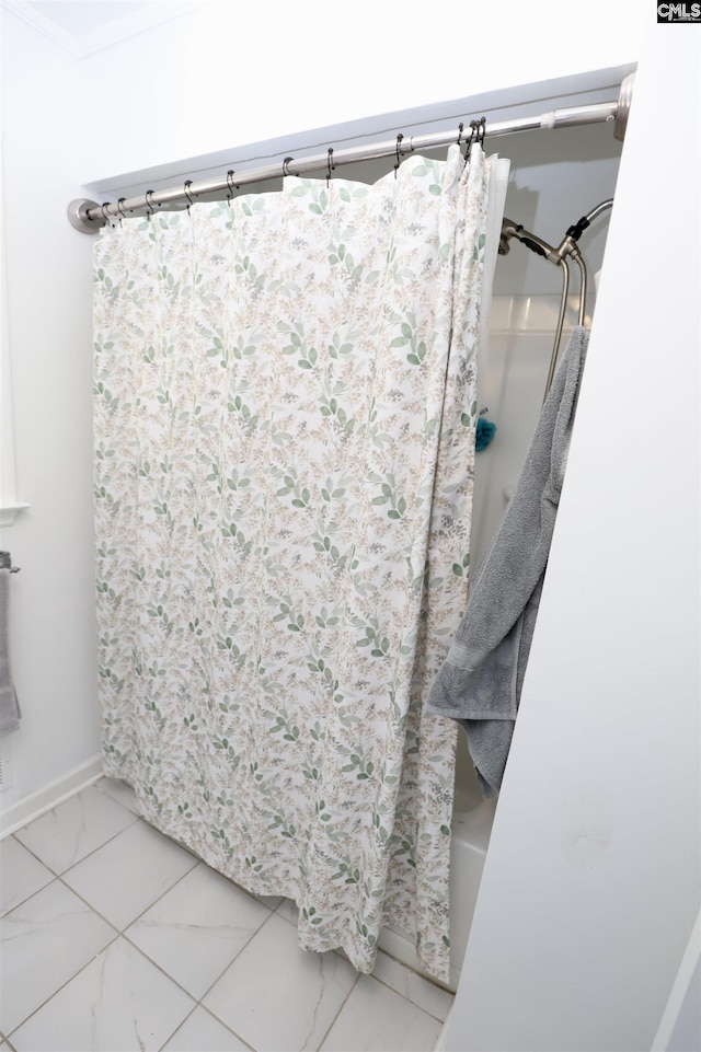 805 Mcrae Rd, Camden, SC 29020 - bathroom featuring marble look tile flooring, shower / tub combo, and baseboards