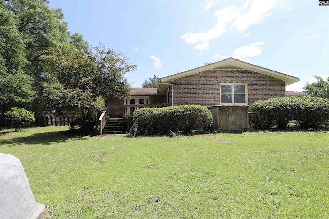 805 Mcrae Rd, Camden, SC 29020 - view of front facade with brick siding, a deck, and stairs