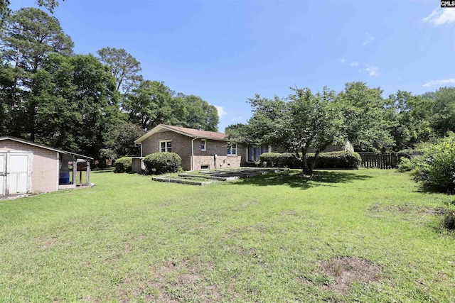 805 Mcrae Rd, Camden, SC 29020 - view of yard with a storage shed and an outbuilding