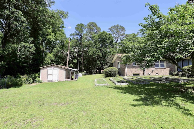 805 Mcrae Rd, Camden, SC 29020 - view of yard featuring a shed, an outdoor structure, and a garden