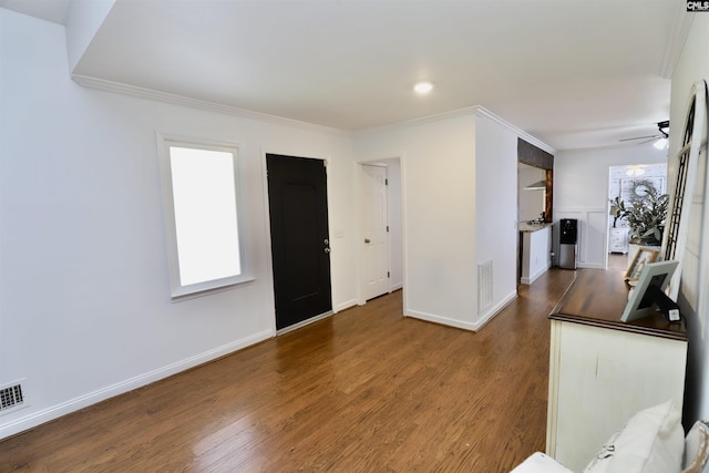 805 Mcrae Rd, Camden, SC 29020 - unfurnished living room with wood finished floors, ornamental molding, ceiling fan, and baseboards