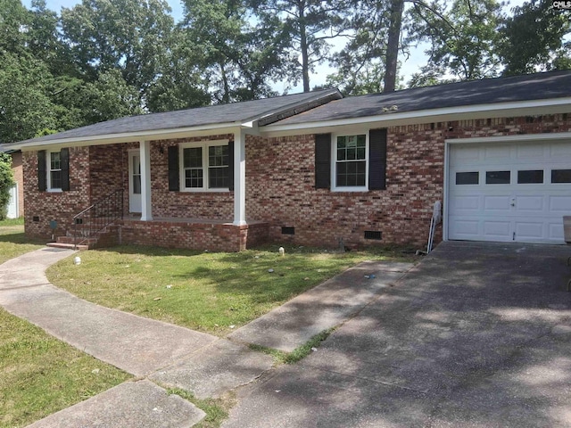 1904 Elise Rd, Columbia, SC 29210 - ranch-style home with crawl space, a front lawn, an attached garage, asphalt driveway, and brick siding