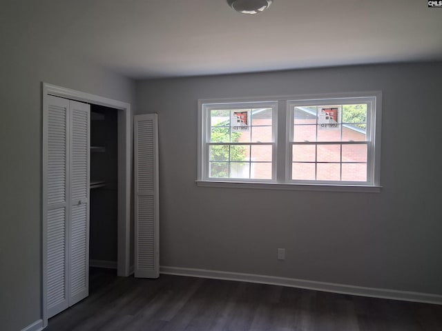 1904 Elise Rd, Columbia, SC 29210 - unfurnished bedroom featuring dark wood-style floors, baseboards, and a closet