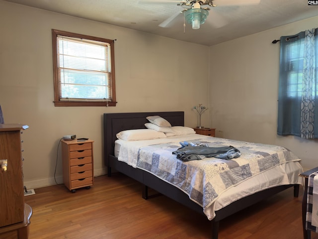 2313 Omega Dr, Columbia, SC 29223 - bedroom with wood finished floors, baseboards, and ceiling fan