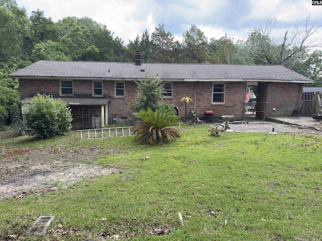 2313 Omega Dr, Columbia, SC 29223 - rear view of house featuring a patio, brick siding, and a chimney