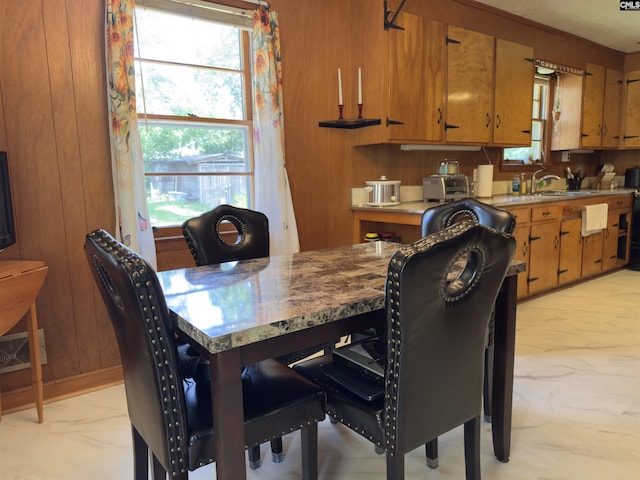 2313 Omega Dr, Columbia, SC 29223 - dining area with light marble finish floors and wooden walls