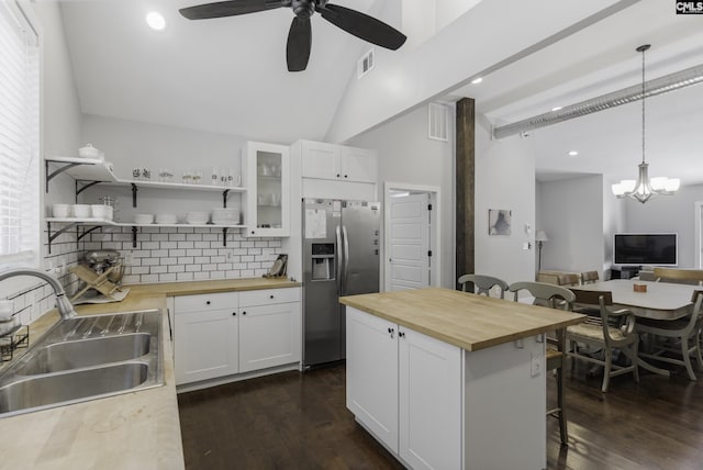2033 Old Hilton Rd, Chapin, SC 29036 - kitchen with wooden counters, stainless steel fridge, a sink, a breakfast bar area, and tasteful backsplash