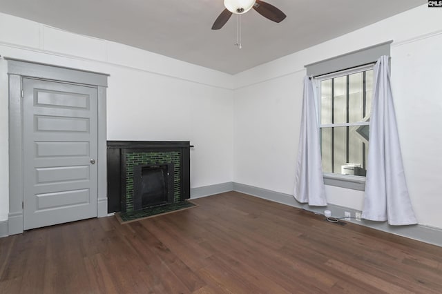 728 Laurel St, Columbia, SC 29201 - unfurnished living room featuring ceiling fan, dark wood-type flooring, and a fireplace with flush hearth