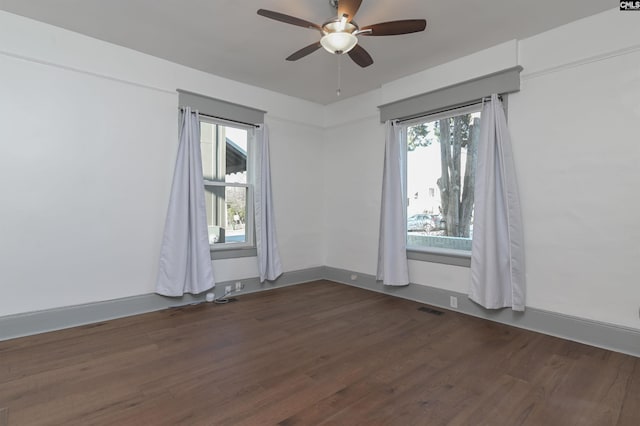 728 Laurel St, Columbia, SC 29201 - spare room with dark wood-style floors and a ceiling fan