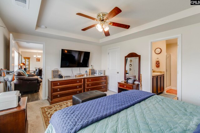 156 Honey Tree Rd, Columbia, SC 29209 - bedroom featuring light wood finished floors, a raised ceiling, a ceiling fan, ensuite bathroom, and a chandelier