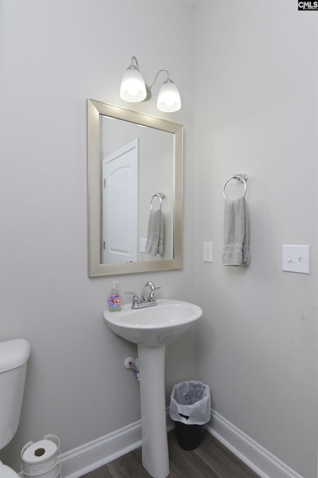 245 Long Iron Ct, West Columbia, SC 29172 - half bathroom with baseboards, wood finished floors, and toilet