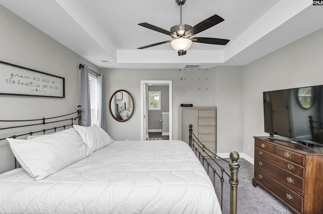 245 Long Iron Ct, West Columbia, SC 29172 - carpeted bedroom featuring a raised ceiling, baseboards, and ceiling fan