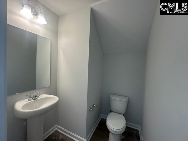 1023 Skyline Rd, Columbia, SC 29229 - half bath with toilet, baseboards, and a sink