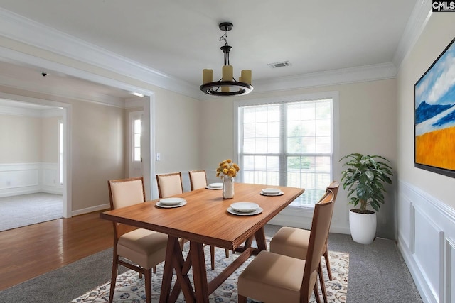1 Duffie Ct, Columbia, SC 29229 - dining room with plenty of natural light, a chandelier, a decorative wall, light wood-style floors, and a wainscoted wall