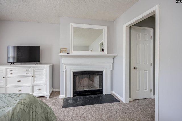 6 Hedgefield Ct, Irmo, SC 29063 - carpeted bedroom with baseboards, a fireplace with flush hearth, and a textured ceiling