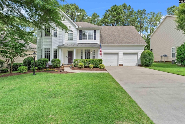306 Austree Dr, Columbia, SC 29229 - traditional home featuring an attached garage, a standing seam roof, concrete driveway, and a front lawn