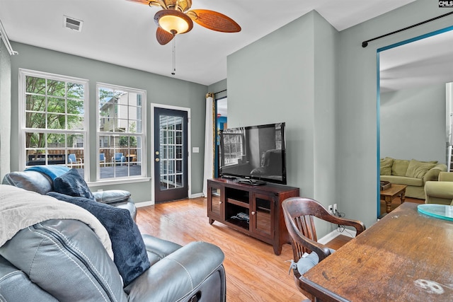 306 Austree Dr, Columbia, SC 29229 - living area with light wood finished floors, a ceiling fan, and baseboards