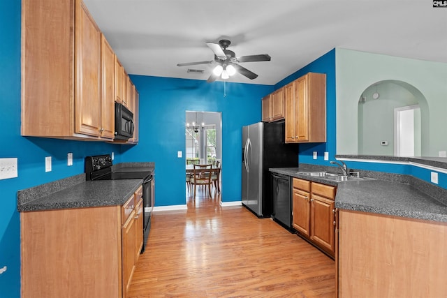 306 Austree Dr, Columbia, SC 29229 - kitchen with black appliances, a sink, dark countertops, ceiling fan, and light wood-style floors