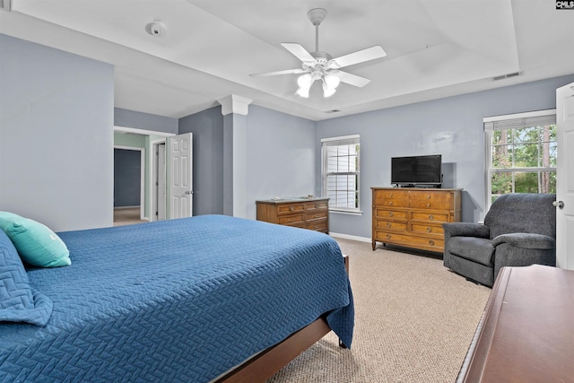 306 Austree Dr, Columbia, SC 29229 - bedroom featuring light carpet, a tray ceiling, ceiling fan, and baseboards