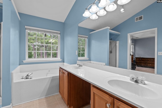 306 Austree Dr, Columbia, SC 29229 - full bathroom with vaulted ceiling, a stall shower, a garden tub, and double vanity