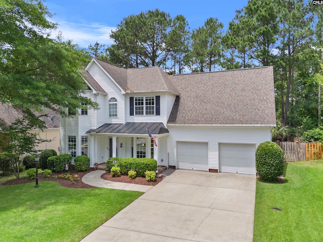 306 Austree Dr, Columbia, SC 29229 - view of front of home with an attached garage, driveway, a porch, a standing seam roof, and metal roof