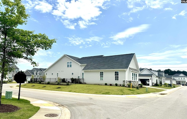 2215 High Bluff Loop, Lexington, SC 29072 - view of property exterior with a shingled roof, a garage, and a residential view
