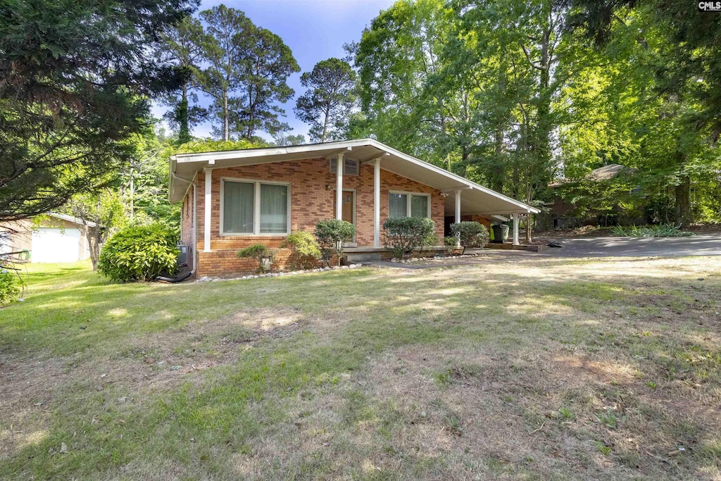 1514 Omarest Dr, Columbia, SC 29210 - view of front of home featuring brick siding, a front yard, and an attached carport