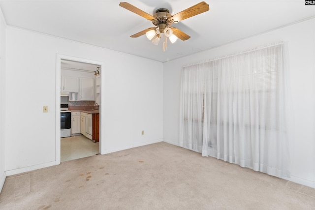 1514 Omarest Dr, Columbia, SC 29210 - unfurnished room with light colored carpet, ceiling fan, a sink, and baseboards