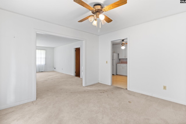 1514 Omarest Dr, Columbia, SC 29210 - unfurnished room with light colored carpet, a ceiling fan, and baseboards