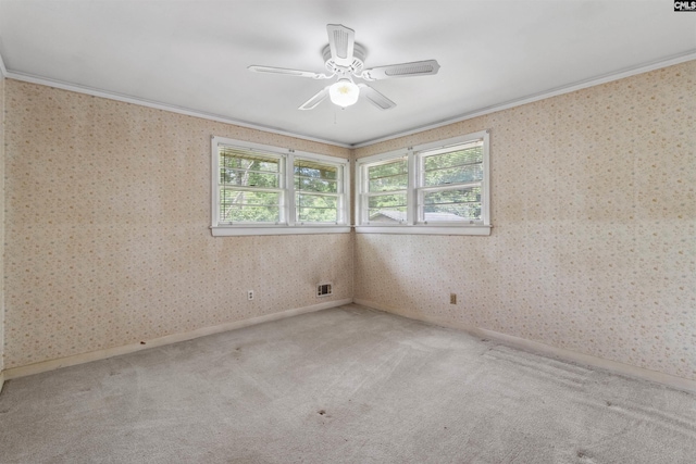 1514 Omarest Dr, Columbia, SC 29210 - empty room featuring crown molding, light carpet, wallpapered walls, and ceiling fan