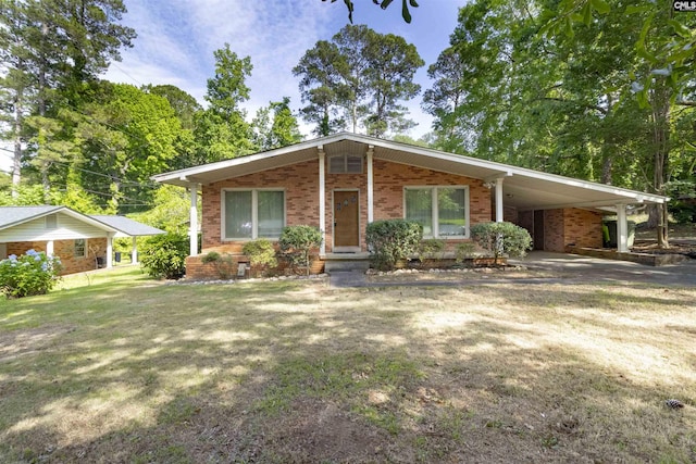 1514 Omarest Dr, Columbia, SC 29210 - view of front of house with brick siding, an attached carport, driveway, and a front lawn