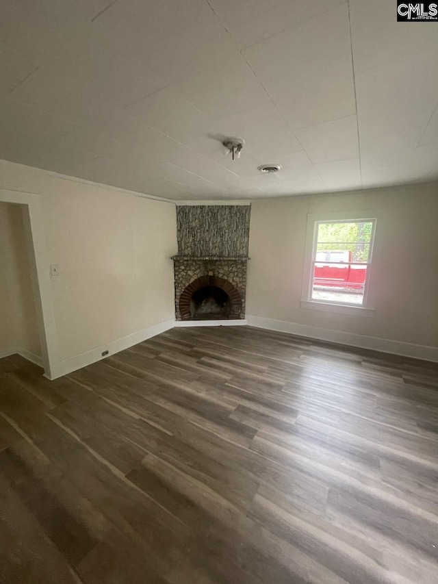 2803 Stewart St, Camden, SC 29020 - unfurnished living room with dark wood finished floors, baseboards, and a fireplace
