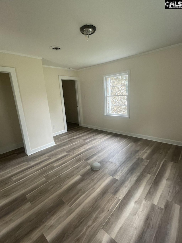 2803 Stewart St, Camden, SC 29020 - unfurnished bedroom with ornamental molding, baseboards, and dark wood finished floors