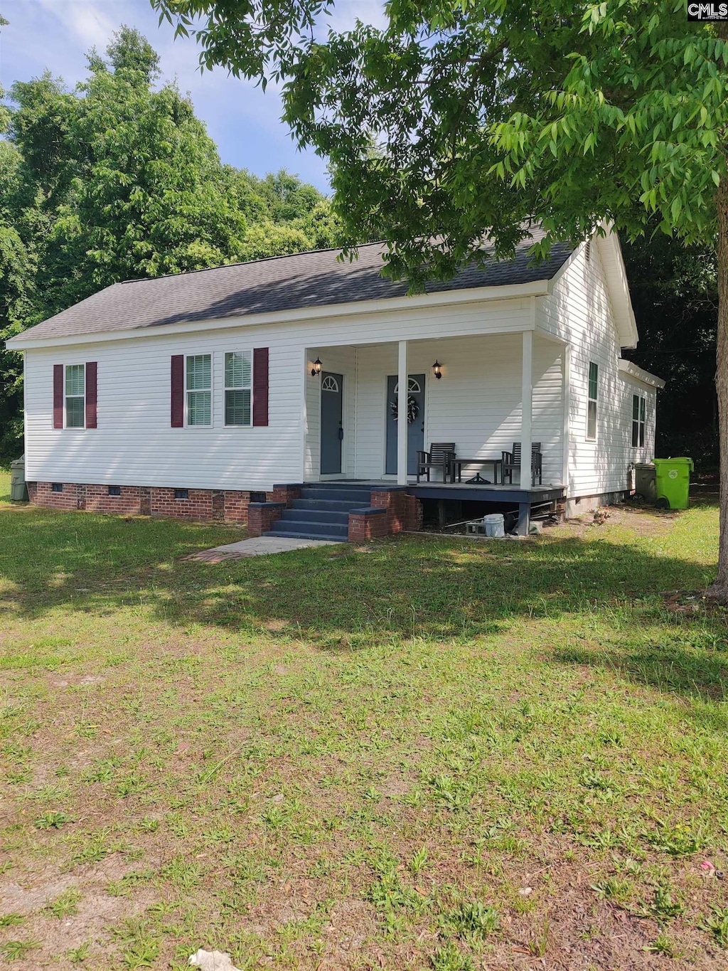 202 Carolina St, Columbia, SC 29201 - view of front of house featuring crawl space, covered porch, and a front lawn