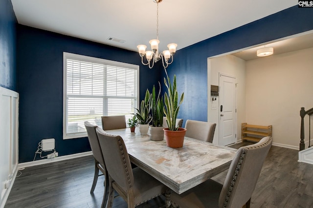 121 Bridgeport Rd, Elgin, SC 29045 - dining area featuring a chandelier, dark wood finished floors, and baseboards